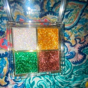 Face glitter it sticks to your face for awhile and is washable